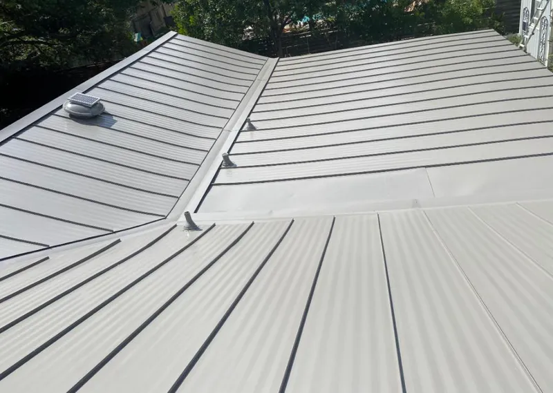 Solar attic fan installed on a metal roof for Roof Ventilation in Cheyenne